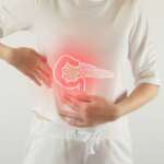 A person experiencing abdominal pain related to pancreatitis and pancreas.